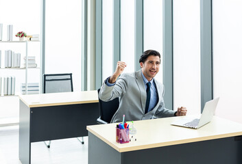 Portrait of a businessman wearing a suit Sitting at my desk smiling and pretending to be successful...