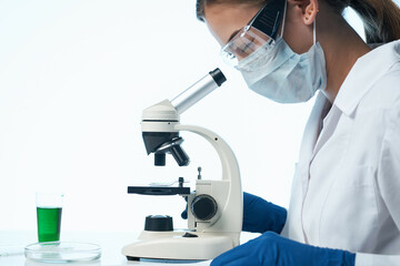 Naklejka na ściany i meble female doctor laboratory research microscope biotechnology professional