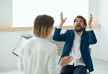 man communicates with woman job interview office emotions