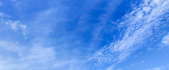 Naklejka na ściany i meble blue sky with white clouds and sun light. Nature background of sky 