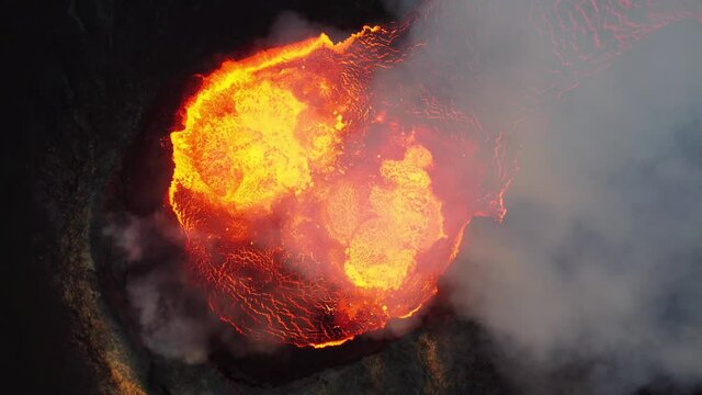 Close look on volcano. Incredible aerial of the dramatic volcanic eruption of the Fagradalsfjall (Geldingadalur) volcano in Reykjanes peninsula Iceland. Flowing lava. Drone footage.