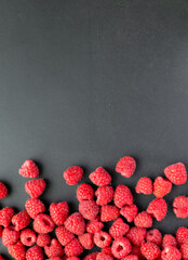 Fresh and sweet raspberry in a dark background. Top view © Sasha