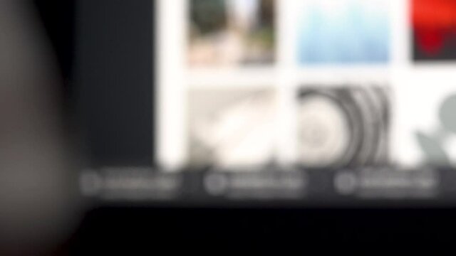 4K close up of wine of glass in front of computer