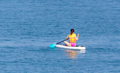 The girl floats on a board