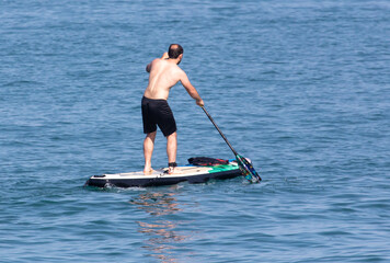 A man floats on a board