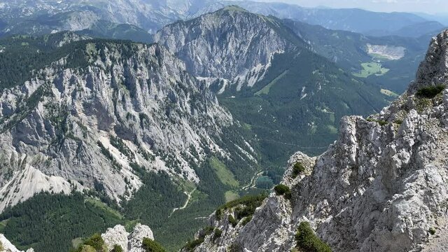 View from Edelwei&szlig;boden over Hochschwab mountain range down into Valley to mountain lake.