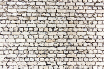 White rough brick wall is used in construction