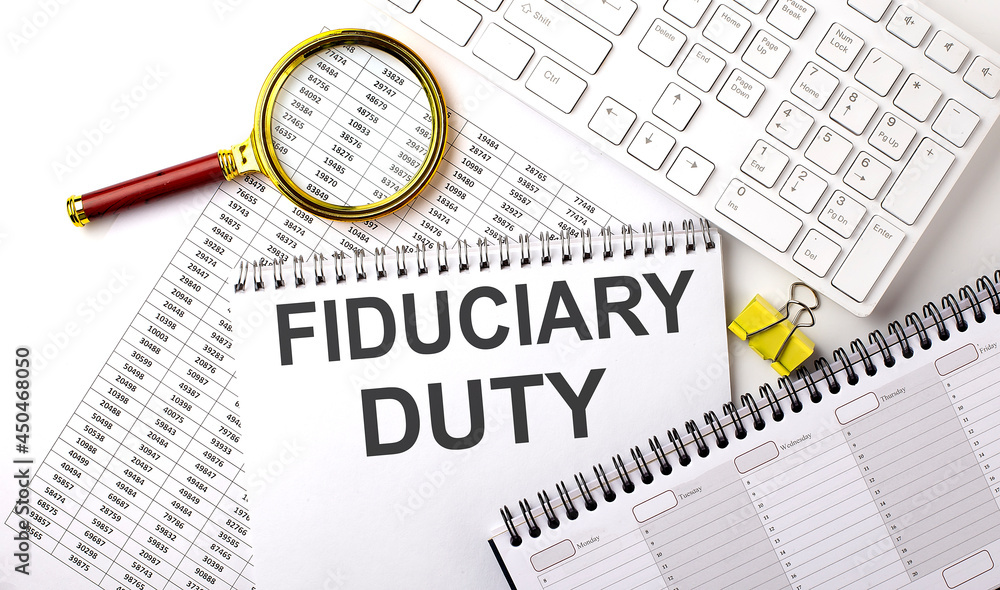 Poster fiduciary duty text written on notebook on chart with keyboard and planning