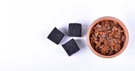Hookah bowls with tobacco and charcoal for smoking on a white background. Space for text. Banner
