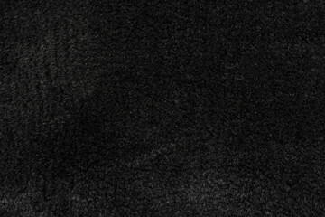 Black wool seamless texture background. dark texture with short factory wool