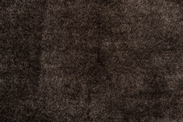 Brown factory material with pile and wool background texture. fur coat texture. sofa texture