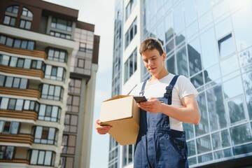 A man carrying package from delivery car - courier service concept