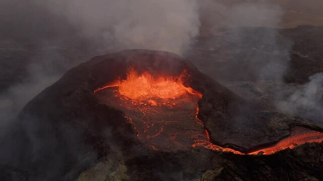 Exploding Volcano Crater With Hot Lava Flowing And Smoke Rising. Volcanic Eruption. aerial