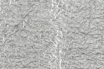 Seamless background texture of silver foil. shiny white surface. reflector