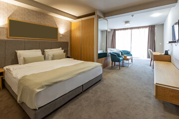 Interior of a luxury hotel double bed bedroom in the morning