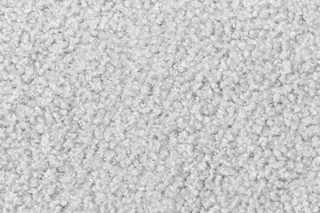 White curly wool seamless texture background. texture with short factory material.