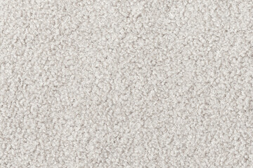 White curly wool seamless texture background. texture with short factory material.