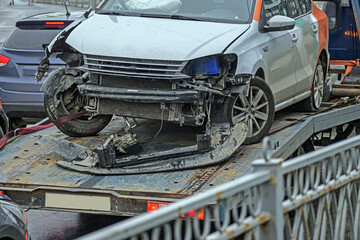 The car is being evacuated from the scene of the accident