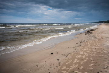 Baltic sea, waves and dark sky in summer day. 
