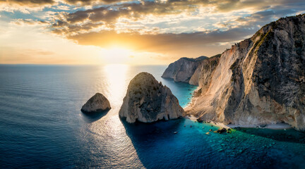 Fototapeta na wymiar Panoramic aerial view to the beautiful Mizithres rocks and beaches at the west coast of Zakynthos island, Greece, during a colorful summer sunset