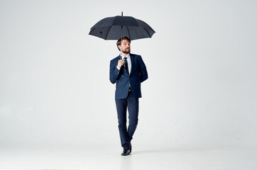 business man in a suit umbrella overhead protection