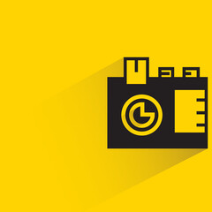 digital camera with shadow on yellow background