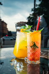 Pink cocktail with fresh grapefruit and ice, mint