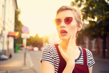 pretty woman wearing sunglasses outdoors walk posing fun