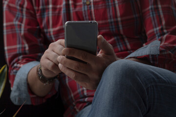 relaxed man on the sofa with mobile phone
