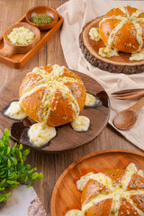 Korean Garlic bread consists of bread topped with garlic and olive oil or butter and may include additional herbs, such as oregano or chives. It is then either grilled in bread oven.
