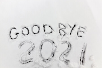 the inscription about the new year 2022 on the snow in winter