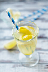 Closeup view of Limeade in a glass. Bright wooden background. 