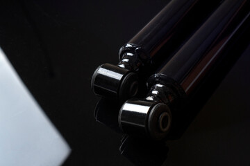 New car shock absorbers lying on the black table