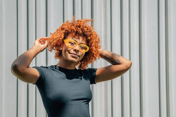 portrait afro american girl with glasses smiling fashion outdoors