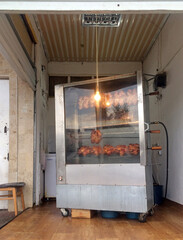 Rotisserie chicken being sold from an old grill in Cholpon Ata, Kyrgyzstan