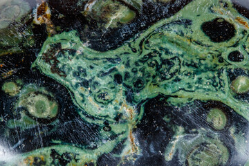 Macro mineral stone jasper kambaba on a white background