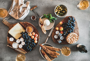 Flat-lay of wineglasses with rose or orange wine and snacks