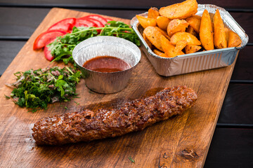 grilled Lula kebab with spices, Beef kafta on the wooden board