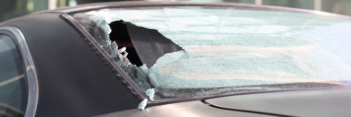 Closeup of hole in rear window of car