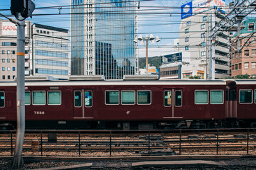 Old train on the station in the modern city of Kobe, Japan