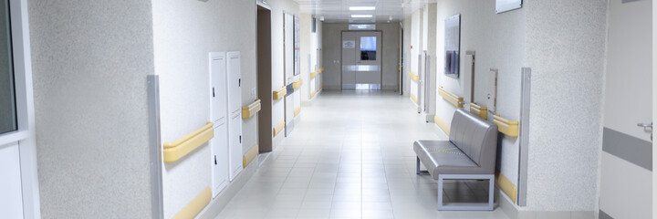 Fototapeta na wymiar Empty modern hospital corridor with sitting couch