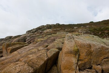 Cliffs, rocks, sea and surf on the Cornish coastline. On the Lands End pennisula between St Loy's Cove and Tater-Du lighthouse