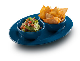 Guacamole con doritos en cuenco azul. Guacamole with doritos in blue bowl.