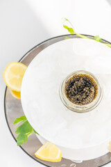 Appetizers of natural sturgeon black caviar, lemon and parsley
