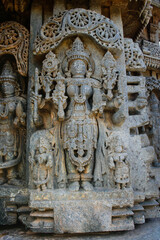 Fototapeta na wymiar Highly detailed intrinsic carvings of 800 year old hindu temple at Somnathpur, Karnataka, India. Temple dedicated to Lord Vishnu was built by the Hoysala Dynasty.