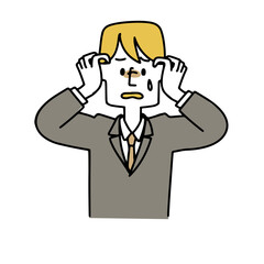 頭を抱えているスーツの男性