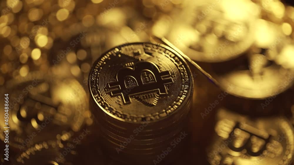 Poster golden bitcoin coins are rotating on a dark background. virtual cryptocurrency payment system and di