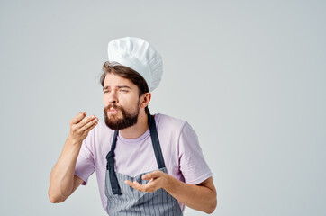 Cheerful male chef kitchen professional working with food