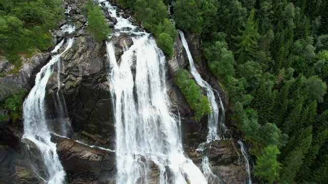 Norwegian Vestland Scenic Roadside Furebergfossen Waterfalls Aerial Photo. Vista Point and Parked RV Camper Vans.