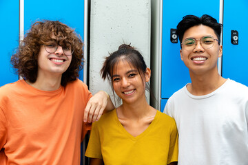 Happy and smiling multiracial group of teen high school students looking at camera.